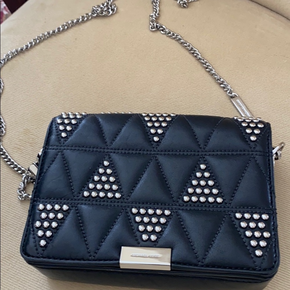 Michael Kors Small black leather crossbody purse with silver accents